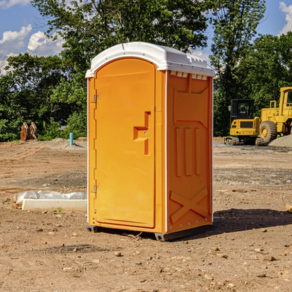 what is the cost difference between standard and deluxe portable restroom rentals in Newald